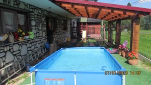 a swimming pool in the yard of a house at DW U Wajdy in Białka Tatrzanska