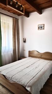 Ein Bett oder Betten in einem Zimmer der Unterkunft Pensiunea Nádas Panzió