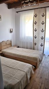 Pensiunea Nádas Panzió tesisinde bir odada yatak veya yataklar