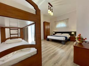 Voodi või voodid majutusasutuse Hotel Benilva toas