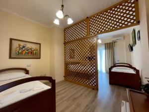 Voodi või voodid majutusasutuse Hotel Benilva toas