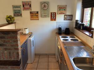 Kuchyň nebo kuchyňský kout v ubytování Appartement Fleurs des champs - Esc'Appart
