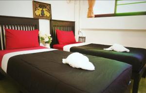 Postel nebo postele na pokoji v ubytování Lanna Hostel