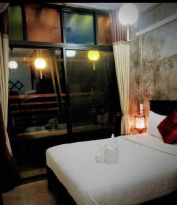 Postel nebo postele na pokoji v ubytování Lanna Hostel