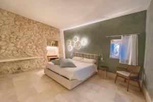 Postel nebo postele na pokoji v ubytování Relais Masseria Capasa