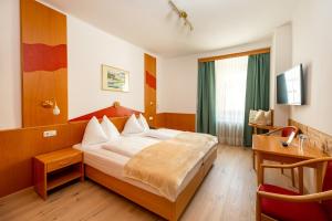 Postel nebo postele na pokoji v ubytování Der Thaller - Wirtshaus - Restaurant - Hotel + 31 fotografií