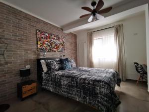A bed or beds in a room at The black dog house