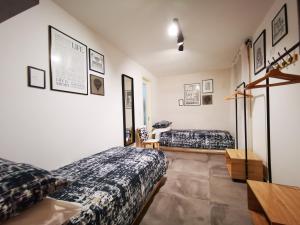 A bed or beds in a room at The black dog house