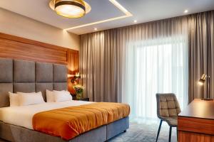 Posteľ alebo postele v izbe v ubytovaní Grand Focus Hotel Szczecin