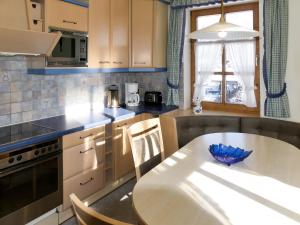 a kitchen with a table with a blue bowl on it at Apartment Stainer by Interhome in Neukirchen am Großvenediger