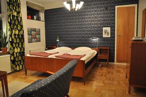 מיטה או מיטות בחדר ב-Laholms Stadshotell