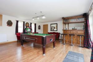 a living room with a pool table in it at ALTIDO Greenknowes Estate - Retreat With Garden, Parking and Hot Tub in Kelty