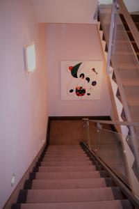 a staircase with a painting on the wall at Park Hotel Sporting in Teramo
