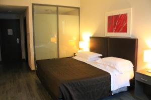 a hotel room with a large bed with two pillows at Park Hotel Sporting in Teramo