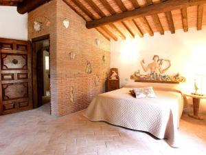 A bed or beds in a room at Holiday Home Casa Del Boscaiolo by Interhome
