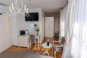 a kitchen with a table and chairs in a room at Gothic Palace Heritage in Split