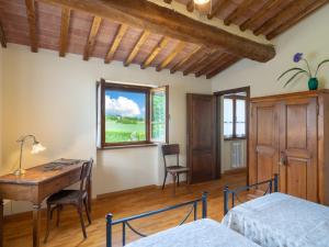 Posteľ alebo postele v izbe v ubytovaní Holiday Home Casale il Giglio-1 by Interhome