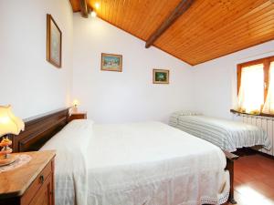 Posteľ alebo postele v izbe v ubytovaní Holiday Home Posticcia Vecchia by Interhome