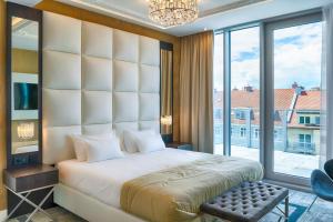Posteľ alebo postele v izbe v ubytovaní Grand Focus Hotel Szczecin