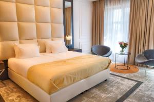 Posteľ alebo postele v izbe v ubytovaní Grand Focus Hotel Szczecin