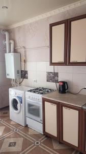 Dapur atau dapur kecil di Cozy Apartment on Rimgorskaia 6