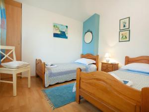 En eller flere senge i et værelse på Apartment Fila-2 by Interhome