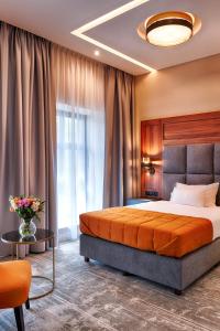 Posteľ alebo postele v izbe v ubytovaní Grand Focus Hotel Szczecin