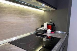 A kitchen or kitchenette at ATTICO Milano-Bicocca