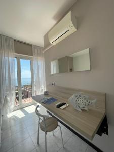 a desk in a room with a view of the ocean at La Casa sul Mare - Monterosso - Cinque Terre in Monterosso al Mare