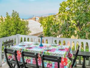 a table with a polka dot table cloth on a fence at Holiday Home Stanka - SNJ218 by Interhome in Sveti Juraj