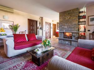 a living room with two couches and a fireplace at Holiday Home I Briganti by Interhome in Narzole