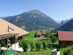 a small village with a mountain in the background at Holiday Home Reindli by Interhome in Innertkirchen
