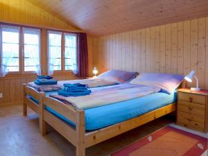 Postel nebo postele na pokoji v ubytování Holiday Home Reindli by Interhome