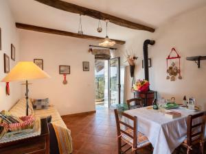 a dining room with a table and chairs at Holiday Home Casa U Baregu by Interhome in Diano San Pietro