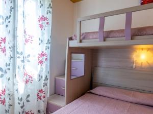 A bed or beds in a room at Holiday Home Gelsomini - CCO522 by Interhome