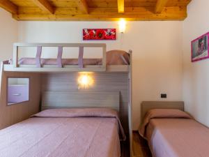 A bed or beds in a room at Holiday Home Gelsomini - CCO522 by Interhome
