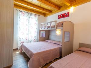 A bed or beds in a room at Holiday Home Gelsomini - CCO522 by Interhome