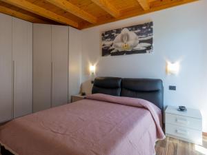 A bed or beds in a room at Holiday Home Gelsomini - CCO522 by Interhome