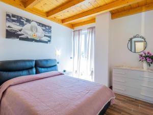A bed or beds in a room at Holiday Home Gelsomini - CCO522 by Interhome