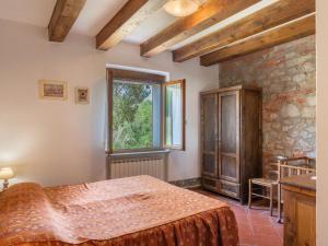 Postel nebo postele na pokoji v ubytování Holiday Home Podere Ritali by Interhome