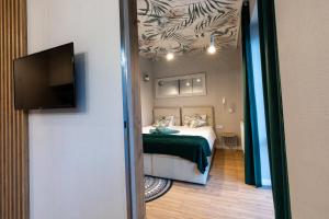 Posteľ alebo postele v izbe v ubytovaní Stylowe Apartamenty Plewiska