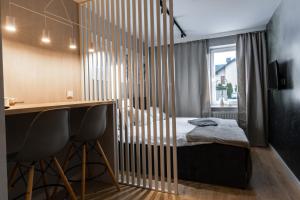 Posteľ alebo postele v izbe v ubytovaní Stylowe Apartamenty Plewiska