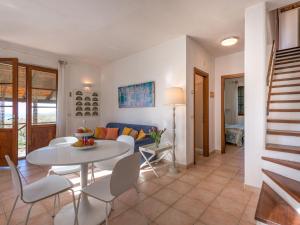 a living room with a white table and chairs at Holiday Home Querceto by Interhome in Sassofortino