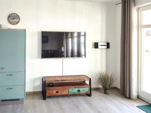 a room with a dresser and a mirror on the wall at Apartment Juliusruh-5 by Interhome in Juliusruh