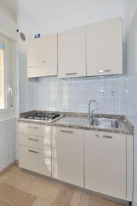 A kitchen or kitchenette at Apartment Residence Pineda by Interhome
