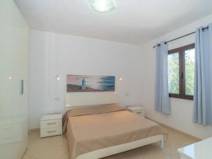 A bed or beds in a room at Holiday Home Pellicano by Interhome
