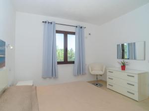 A bed or beds in a room at Holiday Home Pellicano by Interhome