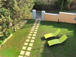 A garden outside Holiday Home Pellicano by Interhome