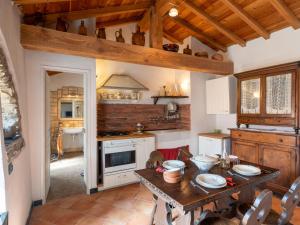 a kitchen with a wooden table in a room at Holiday Home Carametto by Interhome in Andagna
