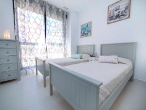 Postel nebo postele na pokoji v ubytování Apartment Calpe Beach II-1 by Interhome